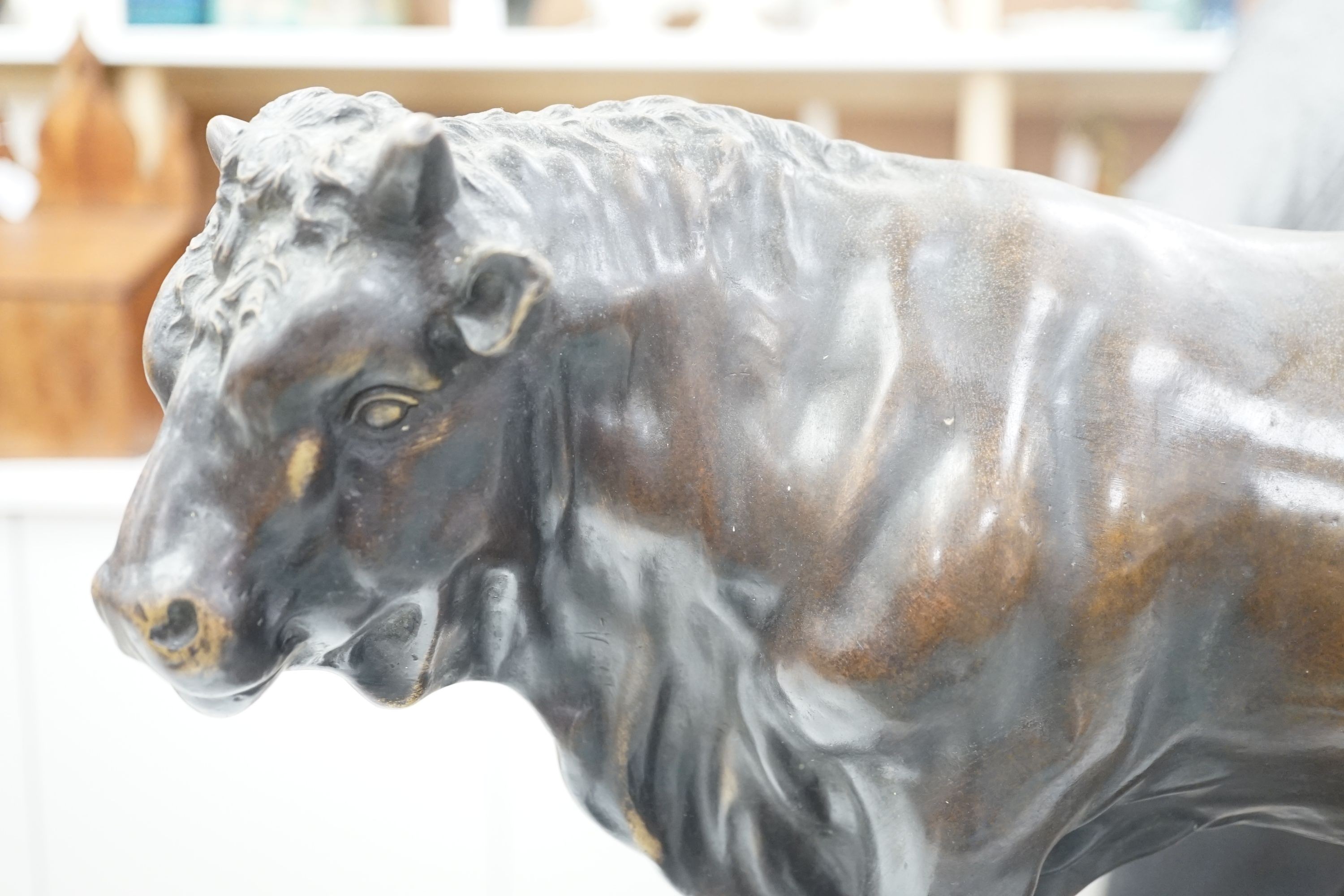 An Animalier style bronzed metal model of a bull, height 35cm